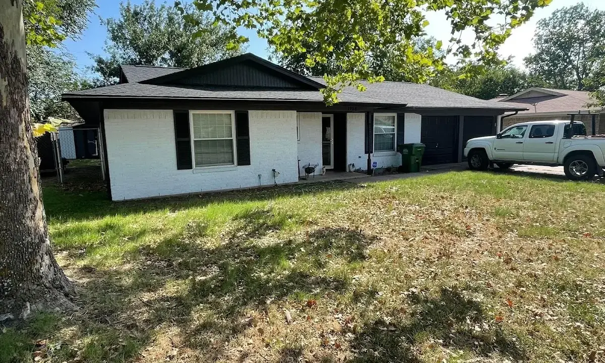 Professional roofing crew working on a residential roof in Cinco Ranch